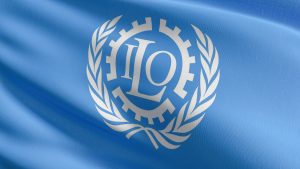 Flag of The International Labour Organization or ILO. United Nations agency whose mandate is to advance social justice and promote decent work by setting international labour standards. 3D render.